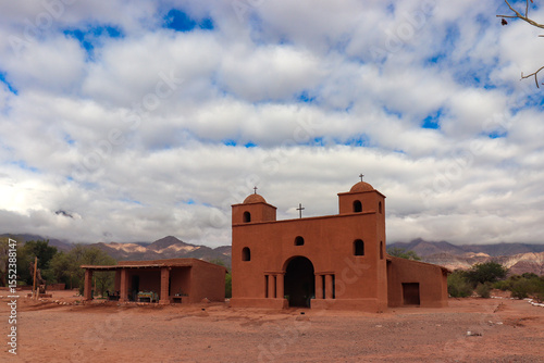 This historic chapel, a jewel of Catamarca's Adobe Route, showcases its colonial religious mud architecture in a mountainous setting, an unmissable tourist attraction