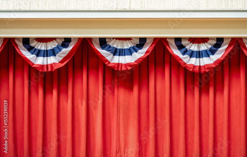 Red Curtain with Red, White, and Blue Bunting Above for a Fourth of July Celebration.
