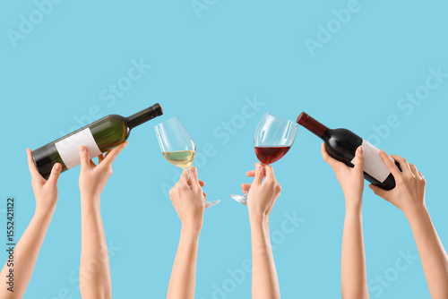Female hands holding glasse...