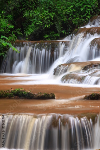Pha Charoen Waterfall is a magnificent limestone waterfall with numerous smallercascades.