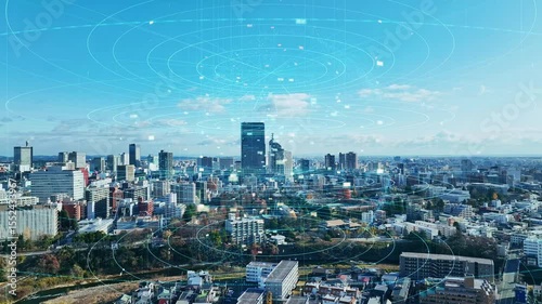 現代都市の空撮風景と通信ネットワークのコンセプト