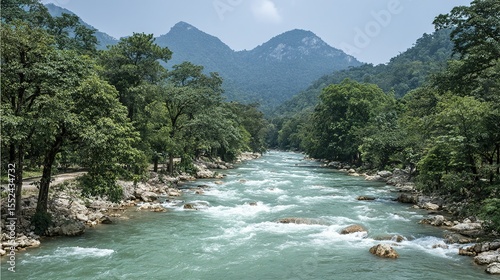 Picturesque river flowing through a lush green valley.