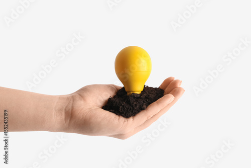 Female hand holding soil wi...