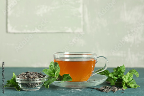 Glass cup of hot mint tea a...