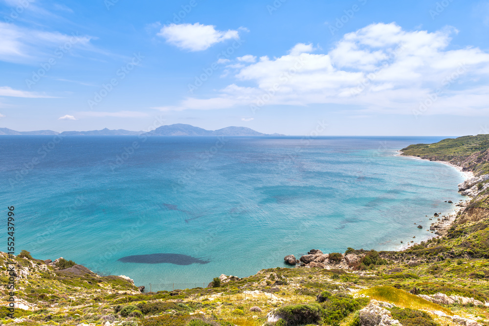 Saint George beach from Drakano tower fortress park on Ikarian Sea, Greek Aegean islands of Ikaria island, Greece by Samos Fournoi islands Saint George beach from Drakano tower fortress park on Ikarian Sea, Greek Aegean islands of Ikaria island, Greece by Samos Fournoi islands