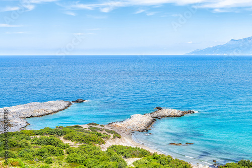 Saint George beach view from Drakano tower fortress archeological site on Ikarian Sea, Greek Aegean islands of Ikaria island, Greece