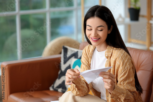 Young woman with paper plan...