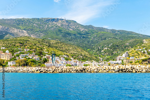 Agios Kirykos harbor port waterfront cityscape by Icarian sea and church on Ikaria, Greece Greek longevity blue zone island from ferry