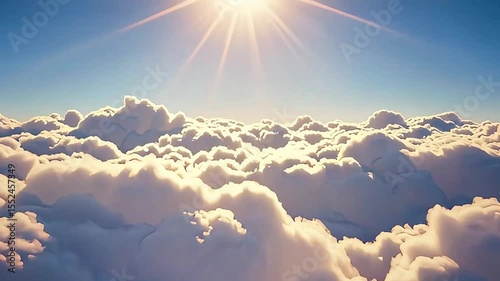 Flying above the clouds towards the bright sun on the horizon. Sunrise, clouds, landscape