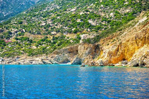 Famous Seychelles beach people swimming on Ikaria island, Greece longevity blue zone by Icarian sea ocean water