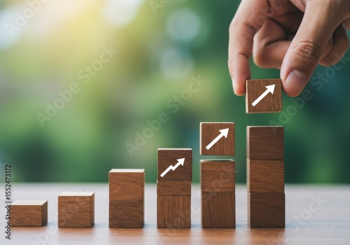 Wooden blocks showing growth and progress