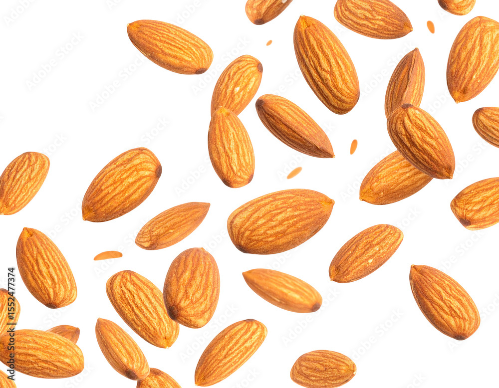 Close-up of numerous almonds, scattered against a black background, showcasing their shape, color, and texture Close-up of numerous almonds, scattered against a black background, showcasing their shape, color, and texture