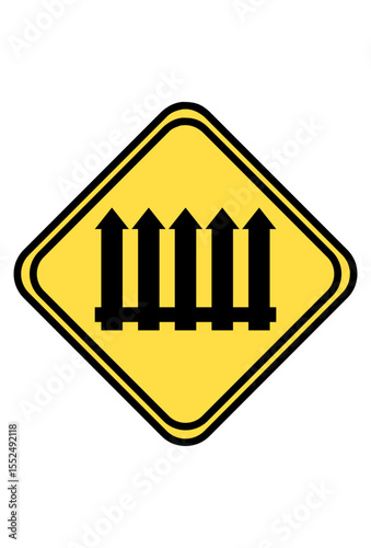 Yellow diamond sign, black railway tracks, warning for train crossing.
Rambu berlian kuning, jalur kereta api hitam, peringatan perlintasan kereta.
 Railroad crossing warning sign, four vertical black