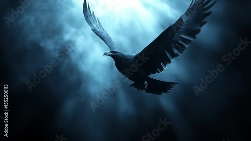 Silhouette of eagle flying through misty sky with sunrays breaking through clouds in dramatic atmospheric composition
