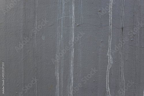 Close Up Of Textured Exterior Wall Featuring Discoloration From Water Runoff