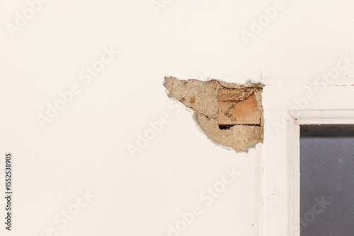 Close Up Of Chipped Wall Showing The Inner Construction Of Brick And Mortar