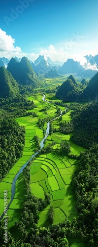 A vibrant aerial view of lush green rice terraces, winding river, and towering karst mountains under a clear blue sky.