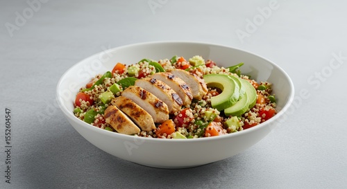 Savor the vibrant flavors of this healthy quinoa chicken salad, perfectly balanced with avocado and fresh tomatoes.