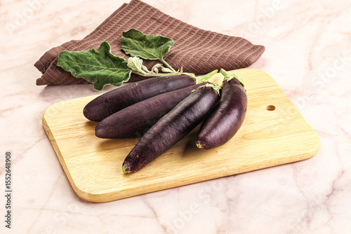 Small few baby eggplant over board