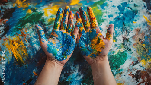Colorful painted hands on abstract background, showcasing creativity and expression for art therapy concept,pchycological aspect,