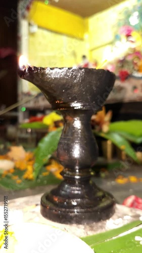 Vertical video of Indian festival Diwali, Closeup Festival Diya or Oil Lamp with Glowing Flame, diwali festive of light celebration background animation for social media story.