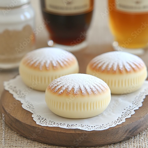 Delightful Japanese Cheese Souffle Cakes with Powdered Sugar on Wooden Board