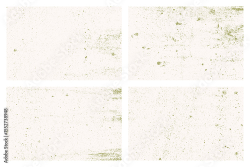 A set of four slightly damaged wall tiles is presented. The tiles have a faded look and are speckled with small green spots to make an aged look.