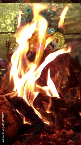 Traditional Hindu fire ceremony with sacred statues, vertical bhakti video template, mandala vertical animation background vertical background for prayer video.