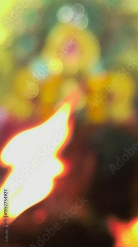 Blurred defocused. Traditional Hindu fire ceremony with sacred statues, Hindu festival vertical video, spiritual vertical background.