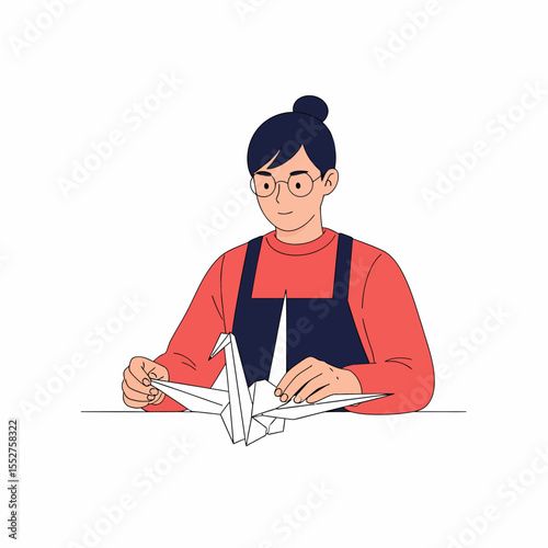 Person creating traditional Japanese origami crane art