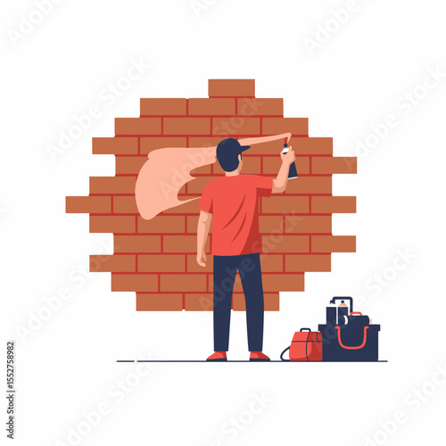 Young Man Spray Painting Graffiti Art onto a Textured Brick Wall at Night
