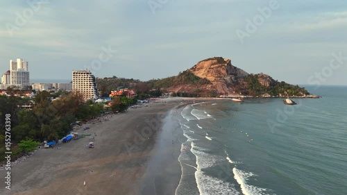Drone flying over peaceful sandy shoreline in Thailand