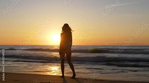 Silhouette of a Woman at Sunrise on a Beach Peaceful Ocean View