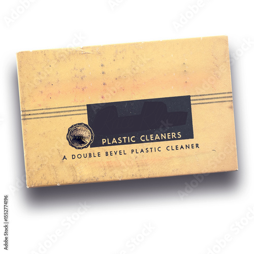 A vintage packaging for a double bevel plastic cleaner, showcasing a simple design and functional purpose.
