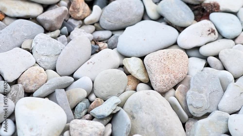natural gray River Rock Pebbles stone Background. Gray large pebbles. Rocks on the beach. Extractive industry of natural resources