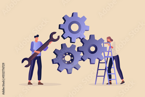 Two people working together to assemble gears with tools and a ladder