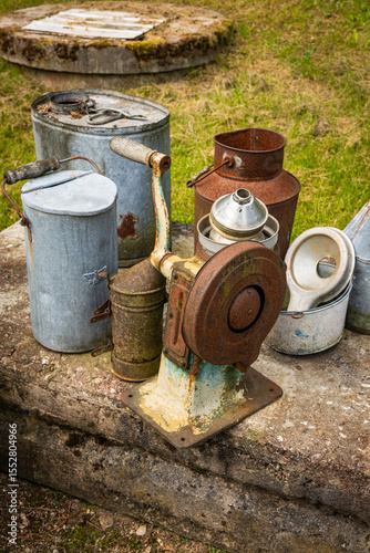 old metal village utensils and cans photo