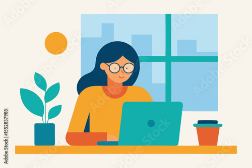 Young woman works on her laptop at an office desk