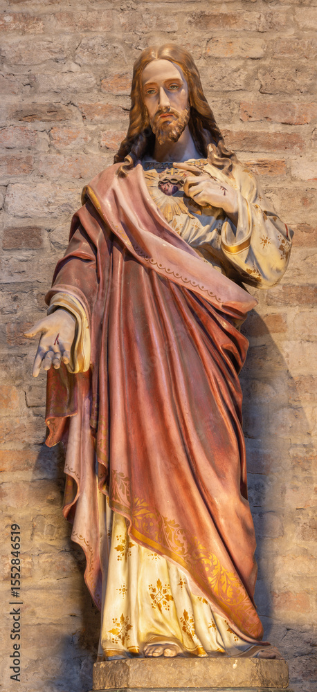 Fototapeta premium PIACENZA, ITALY - MAY 20, 2025: The carved polychrome staue of Heart of Jesus in the church Basilica di San Antonio by unknown artist of 19. cent.