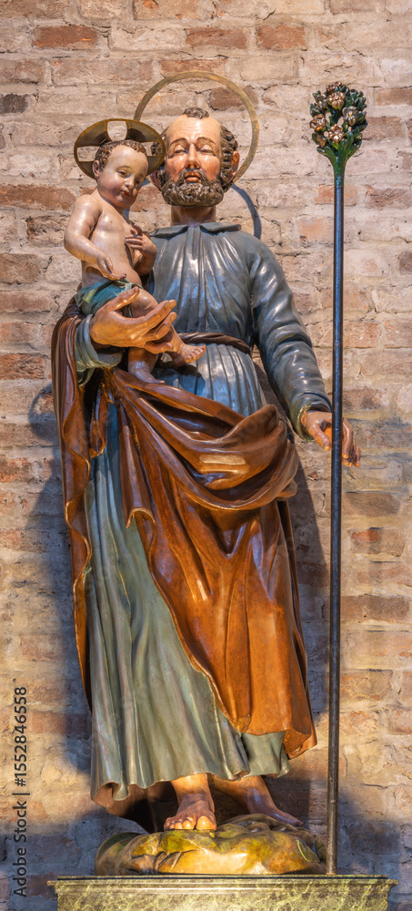 Naklejka premium PIACENZA, ITALY - MAY 20, 2025: The carved polychrome staue of St. Joseph in the church Basilica di San Antonio by unknown artist 