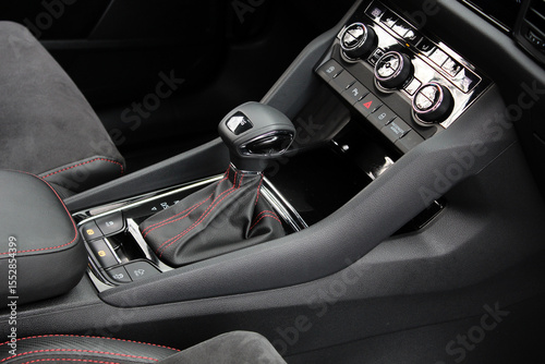 Automatic gear stick. Car interior details. DSG Gear lever close up. DSG transmission. DSG gearbox. Modern Automatic Transmission DSG in Car. Luxury car interior with leather car interior.