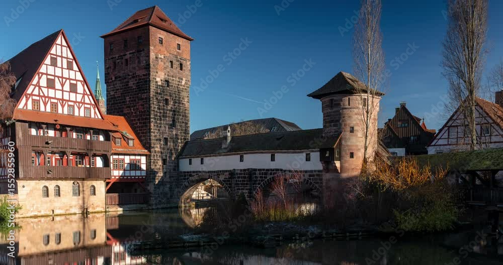 Nuremberg, Germany - December 26, 2024: Medieval Henkersteg bridge in Nuremberg’s preserved old town. Timelapse, slide transition.