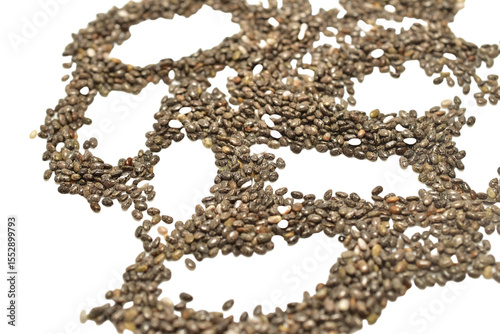 A pile of black chia seeds on a white background.