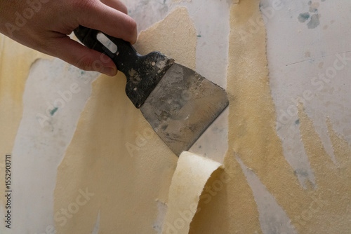 Bathroom renovation. Removing old wallpaper