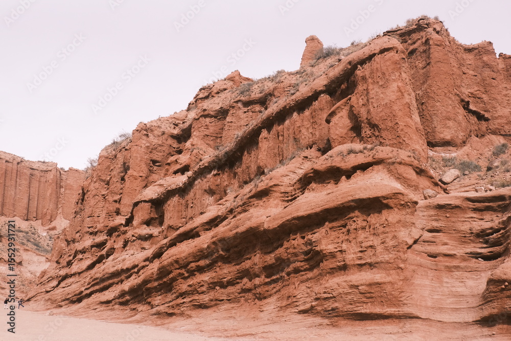 Wenisu Grand Canyon in southern Xinjiang,China, features towering, eroded red cliffs, a testament to millennia of geological evolution. Wenisu Grand Canyon in southern Xinjiang,China, features towering, eroded red cliffs, a testament to millennia of geological evolution.
