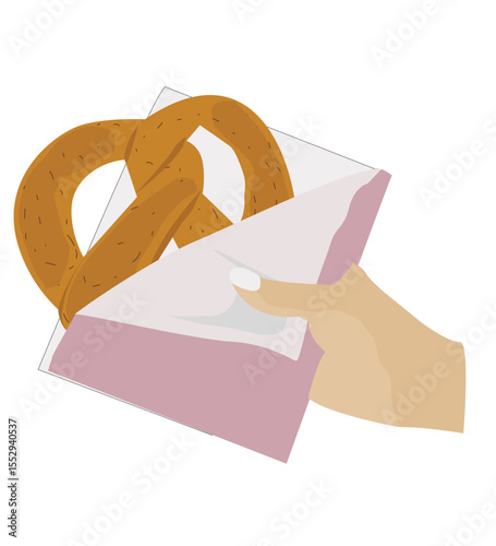 hand holding pretzel. holding a pretzel.