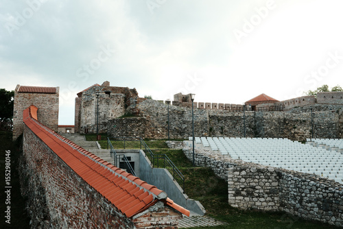 Ancient stone fortress Fetislam with red-tiled roofs and amphitheater seating in front. A historic landmark with preserved walls and scenic surroundings. Kladovo town in Serbia.