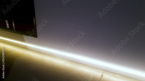 Electric neon baseboard lighting in the room,apartment, design architecture renovation floor with backlighting.