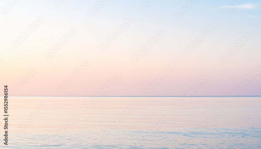 Fototapeta premium the scene captures a serene expanse of water meeting the sky, divided horizontally across the frame