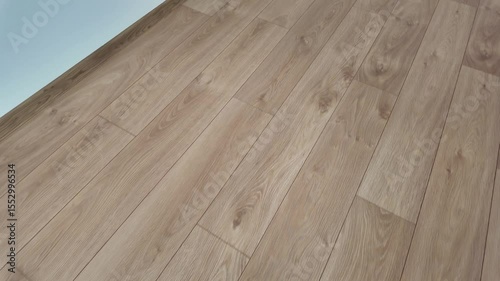 Natural wood laminate parquet floor. Room with floating laminate in new apartmen. Cozy home interior, modern design